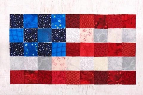Square pieces of fabrics lying like a flag of USA Fotos de archivo