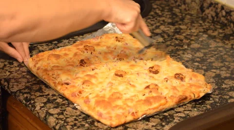 Square Pizza Devided Into Bits Stock Footage 56455211