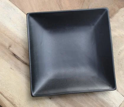 A square plate on the table Stock Photos