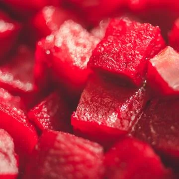 Square raw beetroot slices background. Healthy vegan food Фото