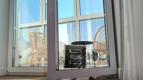 Square robot cleaner washes window corners and edges on glass panel. Automa.. Stock Footage 333143804