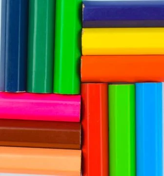 Square shape pattern made with twelve different colored wood pencil crayons p Stock Photos