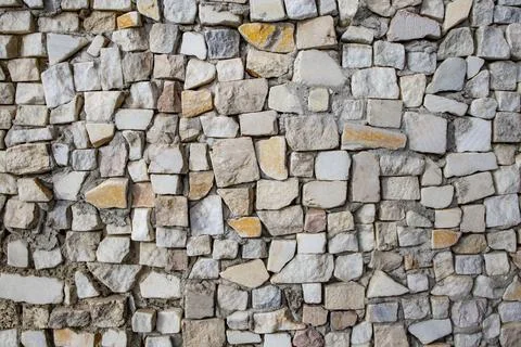 Square shaped granite cubes arranged randomly as a wall decoration, abstrac.. Stock Photos