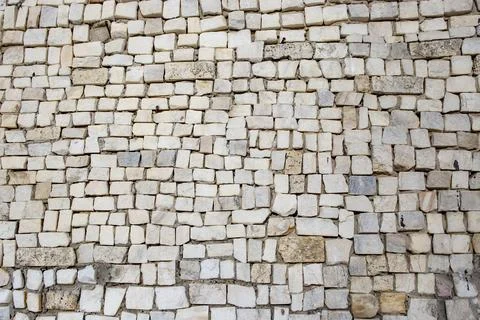 Square shaped granite stone cubes arranged randomly as a wall decoration, a.. Stock Photos