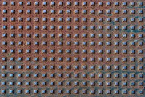 Square shapes on rusted metal surface with patterns and cracks Square shap... Stock Photos