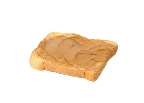 Square slice of wheat bread smeared with peanut butter isolated on white back Stock-Fotos