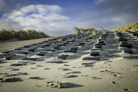 Square stone blocks to protect the coast from the sea Stock Photos