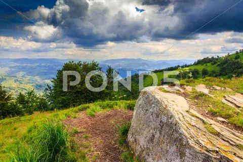 Square stone waiting the storm on top of the mountain Stock Photos
