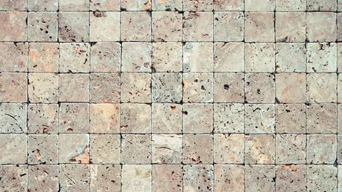 Square stones surface background loop. Travertine masonry tiles cladding wa.. Video stock 224210169