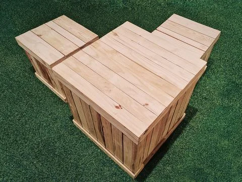 Square Table and Seats Made of Reused Pallet Wooden Planks on Grass Lawn Stock Photos