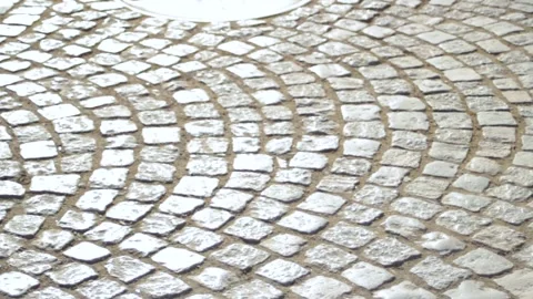 Square tile paving on the road. Beautiful road paving of square tiles along the Stock Footage 315180342