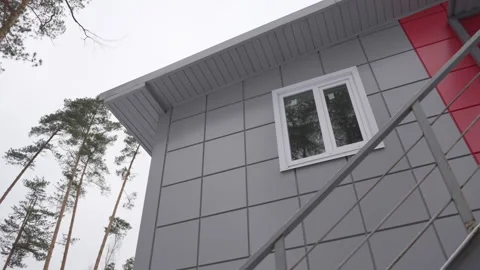 Square-tiled facade highlights central camp building Stock Footage 314653284