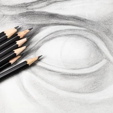 Square view of graphite pencils on drawing of eye Stockfoto's