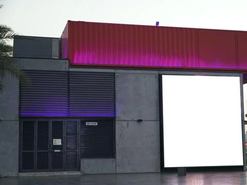 Square white empty signage on a building lit up with lights. Blank white Bill Stock-Fotos