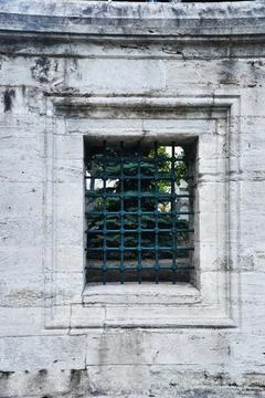 Square window with bars. Stock Photos