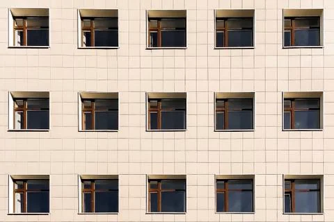 Square Windows of the building on a yellow background, lots of Windows Stock Photos