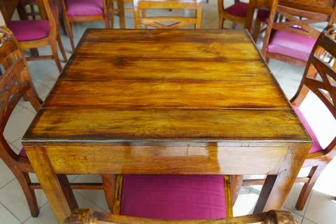 A square wooden dining table in a restaurant Stock Photos