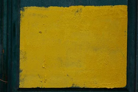 Square of yellow paint on the wall. Stock Photos