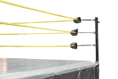 Squared boxing ring with metal structure, padded turnbuckles in bright yellow Stock Photos