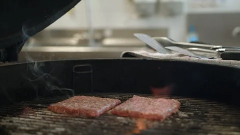 Squared Burger Patties Are Put Onto A Hot Grill, Fire And Smoke   Stock Footage 95149601