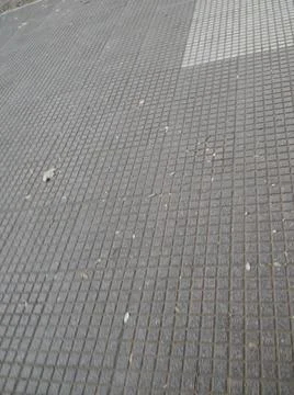 Squared concrete background with different elements in street in daylight Foto stock