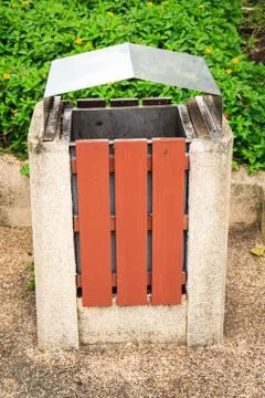 Squared litter bin in the park. trash container. Stock Photos