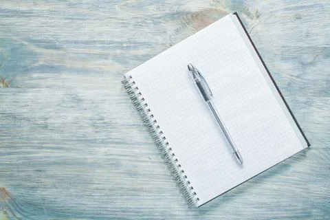 Squared notepad pen on wooden board education concept Stock Photos