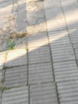 Squared sidewalk concrete background with different elements in street in day 스톡 사진