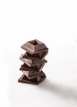 Squares of chocolate on white background Stock Photos