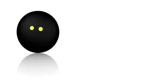 Squash ball turning on a white reflecting floor Stock Footage