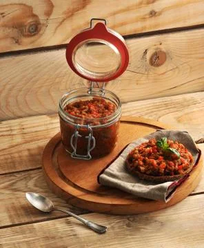 Squash caviar on rye bread with leaf of Basil Stock Photos