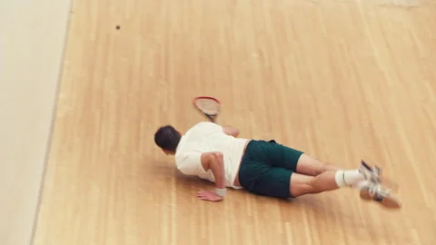 Squash player on the ground Stock Footage 278970121