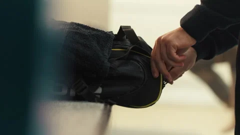 Squash player opening his bag Stock Footage 278978696