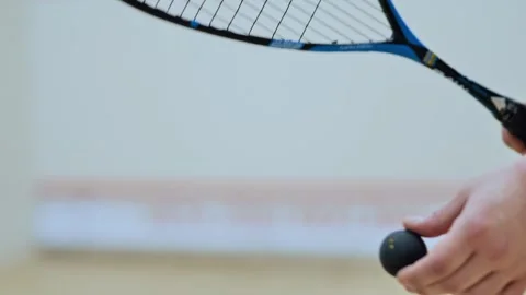 Squash Player Preparing Serve with Racket and Ball - Indoor Sport Scene - 4K Stock Footage 308006746