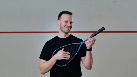 Squash Player Pretends to Serenade With Racket in Flirty Slow Motion Scene Stock Footage 313476582