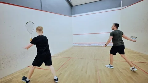 Squash players regroup mid-game on court - light moment between rallies Latvia Stock Footage 308451379