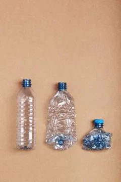 Squashed empty plastic bottles put in a row Stock Photos