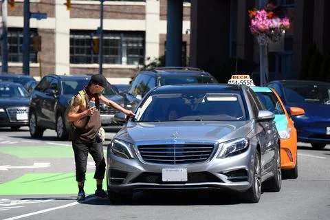 Squeegee man at work in Toronto, Canada Stock Photos