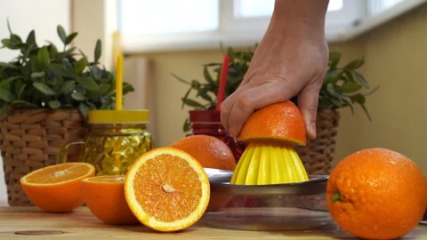 Squeeze juice from orange Video stock 129181550