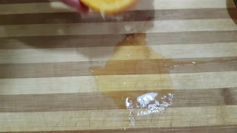 Squeeze juice from orange Stock Footage 134271637