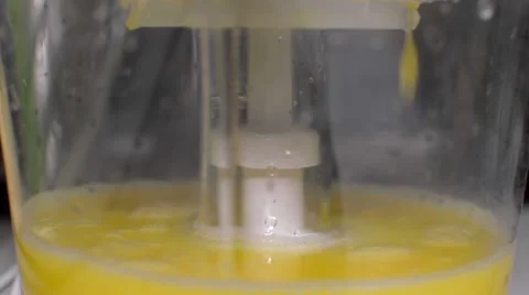 Squeeze the Juice From the Orange in a Juicer Stock Footage 58563156