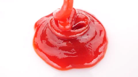 Squeeze ketchup into a white plate, close up Stock Footage 231400958