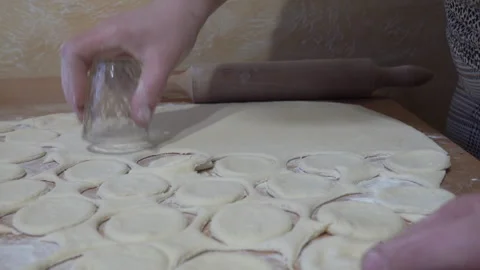 To squeeze out round molds of dough for dumplings Stock Footage 319944860