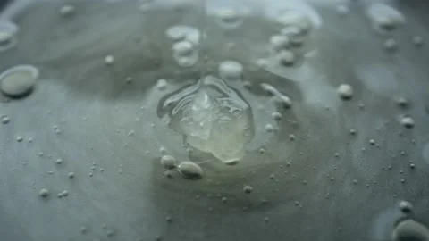 Squeeze Out A Transparent Gel On The Background Video stock 194185591