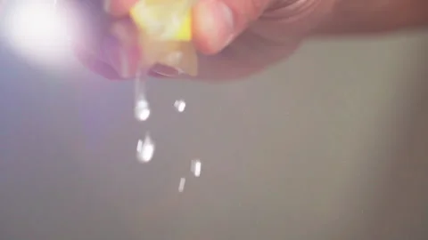 Squeeze piece of lemon slow motion Stock-Footage 158435522