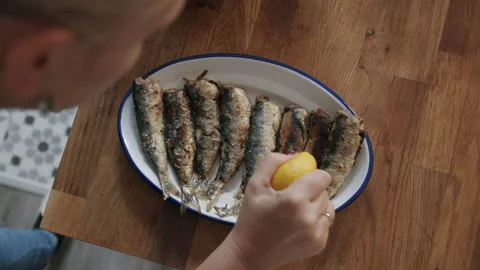 Squeeze some lemon onto my fish 스톡 동영상 145005740