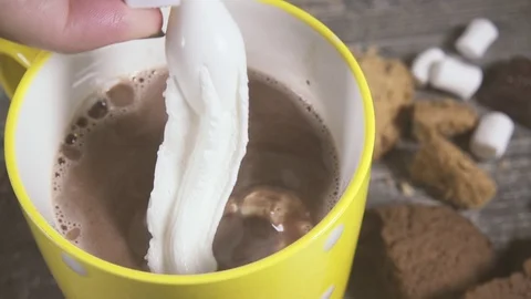 Squeeze the whipped cream out of the can into a mug with a drink close-up Video stock 95394985