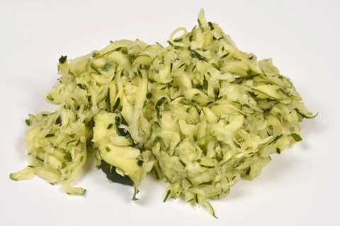 Squeezed Grated Zucchini on White Background Stock Photos