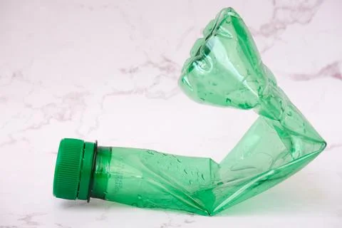 Squeezed green plastic bottles with white background Stock Photos