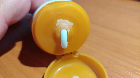 Squeezed hand cream coming out of the tube Vídeos de archivo 333641272